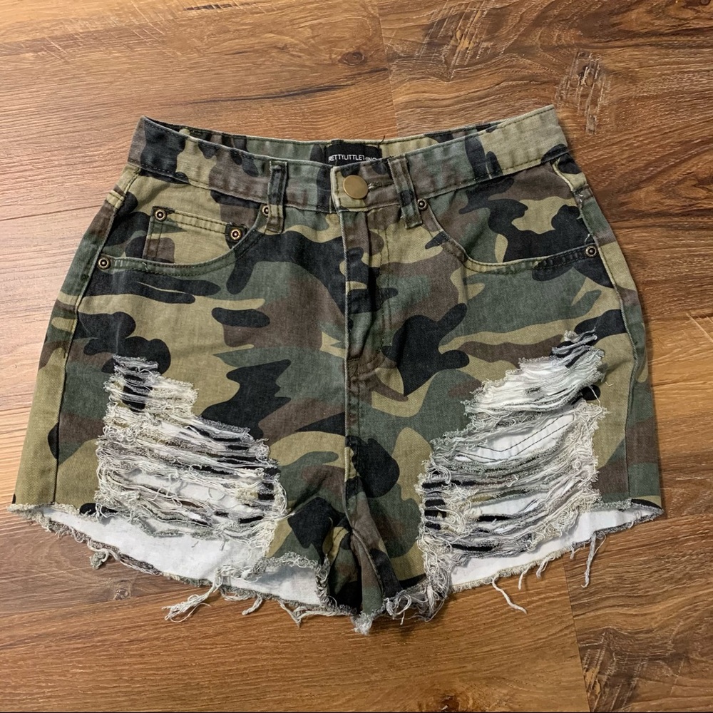 Ripped camo denim shorts